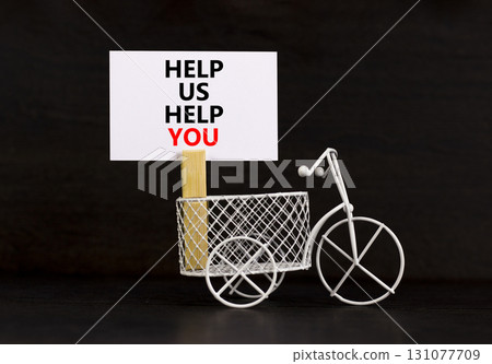 Help you symbol. Concept words phrase Help us help you on beautiful white paper on wooden clothespin. Miniature bicycle. Beautiful black paper background. Business Help you concept. Copy space. Help you symbol. Concept words phrase Help us help you on beautiful white paper on wooden clothespin. Miniature bicycle. Beautiful black paper background. Business Help you concept. Copy space. 131077709