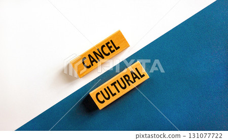 Cancel cultural symbol. Concept words Cancel cultural on wooden blocks on a beautiful blue table white background. Business and cancel cultural concept, copy space. 131077722