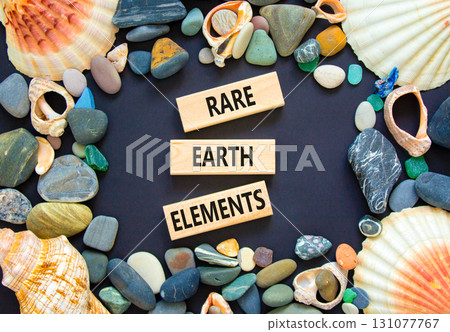 Rare earth elements symbol. Concept words Rare earth elements on beautiful wooden block. Sea stones and shells. Beautiful black background. Business and rare earth elements concept. Copy space. 131077767