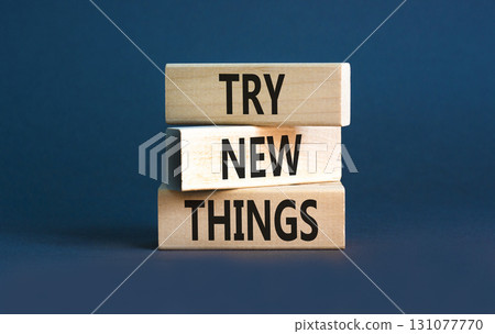 Try new things symbol. Concept words Try new things on beautiful wooden block. Beautiful grey table grey background. Business motivational lifestyle try new things concept. Copy space. 131077770