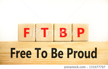 FTBP Free To Be Proud symbol. Concept word FTBP Free To Be Proud on beautiful wooden blocks. Beautiful white background. Business motivational FTBP Free To Be Proud concept. Copy space. 131077787