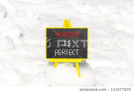 Nobody is perfect symbol. Concept words Nobody is perfect on beautiful blackboard. Beautiful white snow background. Business motivational lifestyle and nobody is perfect concept. Copy space. Nobody is perfect symbol. Concept words Nobody is perfect on beautiful blackboard. Beautiful white snow background. Business motivational lifestyle and nobody is perfect concept. Copy space. 131077870