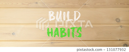 Build habits symbol. Concept word Build habits on beautiful wooden wall. Beautiful wooden wall background. Business build habits concept. Copy space. Build habits symbol. Concept word Build habits on beautiful wooden wall. Beautiful wooden wall background. Business build habits concept. Copy space. 131077932