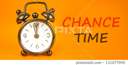 Chance time symbol. Concept word Chance time on beautiful orange paper. Beautiful black alarm clock. Beautiful orange paper background. Business chance time concept. Copy space. Chance time symbol. Concept word Chance time on beautiful orange paper. Beautiful black alarm clock. Beautiful orange paper background. Business chance time concept. Copy space. 131077949