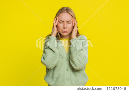 Woman rubbing temples to cure headache problem, suffering from tension and migraine stress pain 131078046