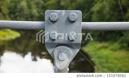 Steel Cable Bolted Connection on Suspension Bridge over River Steel Cable Bolted Connection on Suspension Bridge over River 131078082