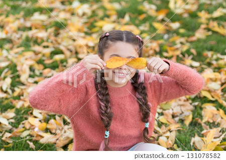 Happy childhood. School time. Autumn leaves and nature. Happy little girl in autumn forest. Small child with autumn leaves. Feeling dry and protected. Going crazy. Feeling totally free Happy childhood. School time. Autumn leaves and nature. Happy little girl in autumn forest. Small child with autumn leaves. Feeling dry and protected. Going crazy. Feeling totally free 131078582