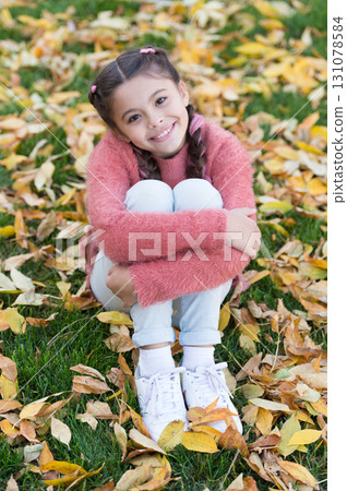 Happy little girl in autumn forest. Small child with autumn leaves. Autumn leaves and nature. Happy childhood. School time. Trendy beauty. Good mood at any weather. Enjoying autumn day Happy little girl in autumn forest. Small child with autumn leaves. Autumn leaves and nature. Happy childhood. School time. Trendy beauty. Good mood at any weather. Enjoying autumn day 131078584
