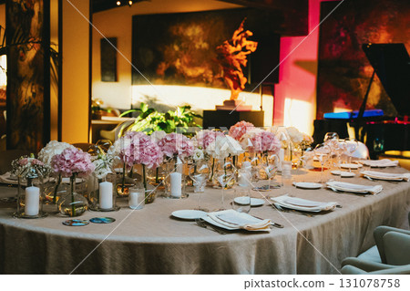 Elegant Table Setting with Floral Centerpieces 131078758