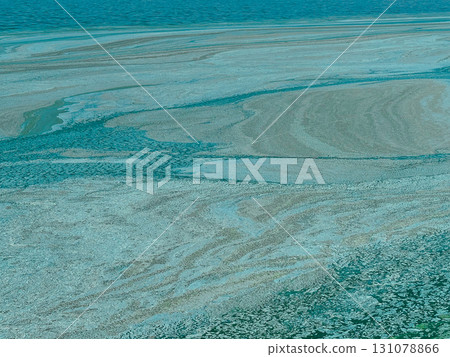 Abstract water surface with floating blue and green algae and pollution textures. Trendy eco-concept for climate change, environmental awareness Abstract water surface with floating blue and green algae and pollution textures. Trendy eco-concept for climate change, environmental awareness 131078866