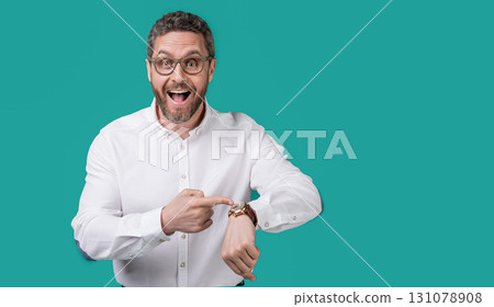 punctual man check time on watch at studio with copy space. punctual man check time on watch punctual man check time on watch at studio with copy space. punctual man check time on watch 131078908