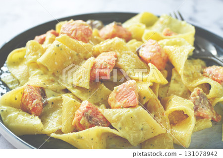 papardelle pasta, in creamy sauce with salmon, homemade, on a gray background, no people, papardelle pasta, in creamy sauce with salmon, homemade, on a gray background, no people, 131078942