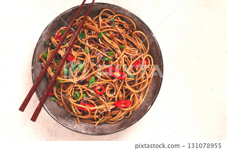 udon noodles, with shimeji mushrooms, vegetables, in sauce, with sesame seeds, green onions, Asian vegetarian food, horizontal, without people, 131078955