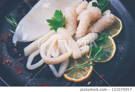Fresh squid , raw, carcass, cut into rings, top view, no people, Fresh squid , raw, carcass, cut into rings, top view, no people, 131078957
