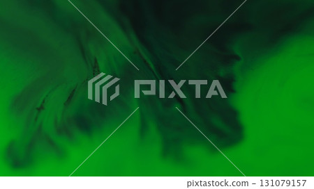 Paint pour. Emulsion flow. Defocused green color chemical pigment liquid blend particles spilling on abstract dark black background. 131079157