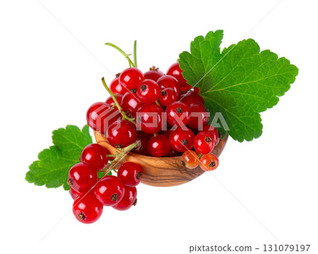 Red currant isolated on white background. Redcurrant or Ribes rubrum ripe berries with green leaves in wooden bowl. 131079197
