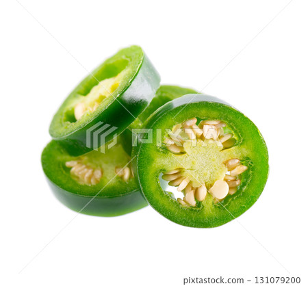 Fresh jalapeno pepper isolated on white background. Slices of green hot serrano pepper. Clipping path. Fresh jalapeno pepper isolated on white background. Slices of green hot serrano pepper. Clipping path. 131079200