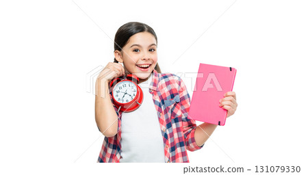 photo of school girl with alarm clock and homework, presenting. school girl with alarm clock 131079330