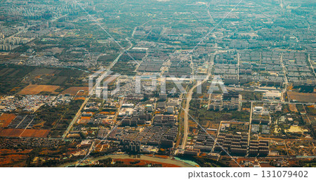 Beijing, China. View From Airplane Window On Multi-story Buildings Of Changhe Garden District In Beijing. Aerial View On Suburb. High-rise Houses Elevated View Cityscape Skyline. Urban Residential Beijing, China. View From Airplane Window On Multi-story Buildings Of Changhe Garden District In Beijing. Aerial View On Suburb. High-rise Houses Elevated View Cityscape Skyline. Urban Residential 131079402