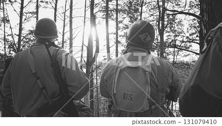 Back View On American Infantry Soldiers standing together At Winter Day. Group Of Usa Soldiers Armed Of Sturmgewehr 44 Or Assault Rifle 44. Usa Army Soldiers Of World War Ii 131079410