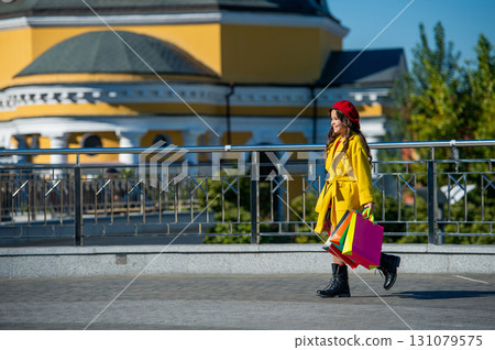 shopaholic girl seasonal passion. autumn shopping sale. copy space. autumn shopaholic girl embraces fall fashion. shopaholic girl navigates fall sales and trends. autumn fashion. buying habits 131079575