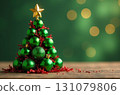 Christmas tree made of green Christmas balls 131079806