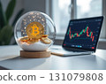 Bitcoin in a snow globe, a laptop with exchange charts on the table 131079808