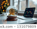Bitcoin in a snow globe, a laptop with exchange charts on the table 131079809