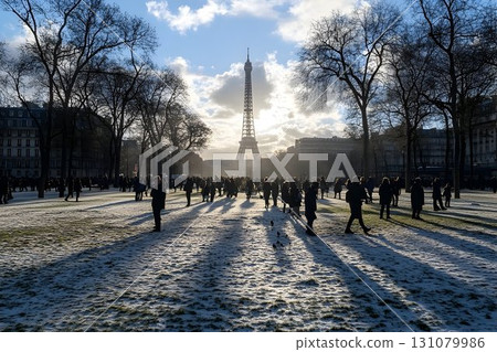 Eiffel Tower Glimmering Through Winter Sunlight in Paris, France Eiffel Tower Glimmering Through Winter Sunlight in Paris, France 131079986