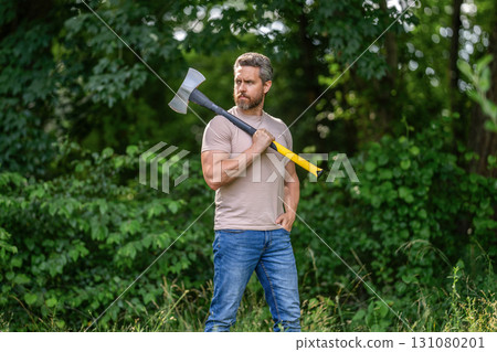Lumberjack on outdoor camping. Brutal lumberjack. Brutality and masculinity. Hispanic lumberjack man with axe. Lumberjack axe. Man with logging axe. Masculine brutal man. Deep in forest 131080201