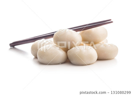Xiao long bao. Chinese dumplings and chopsticks isolated on white background. 131080299