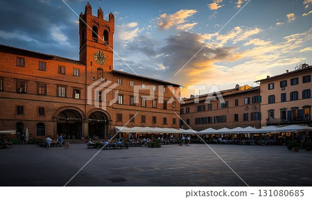 Evening View of Piazza with Clock Tower, Restaurants, and Cloudy 131080685