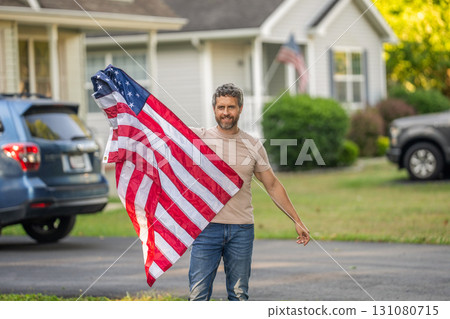 American independence. National flag. Independence day. American Flag for Independence Day or 4th of July. Man hold American flag outdoor. Patriotic man with patriotic symbol. Veterans day American independence. National flag. Independence day. American Flag for Independence Day or 4th of July. Man hold American flag outdoor. Patriotic man with patriotic symbol. Veterans day 131080715