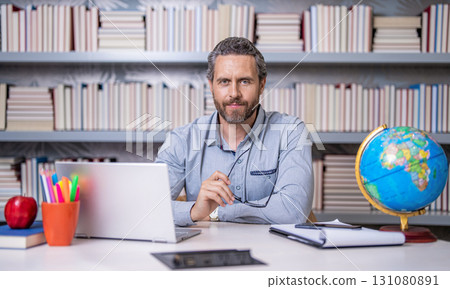 man teacher in school. teacher give school education. knowledge at school lesson. teacher in class. teachers day. knowledge day. school education. knowledge and education. The power of knowledge 131080891