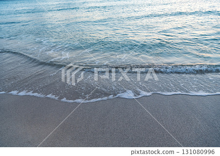 sea or ocean water wave on sandy beach 131080996