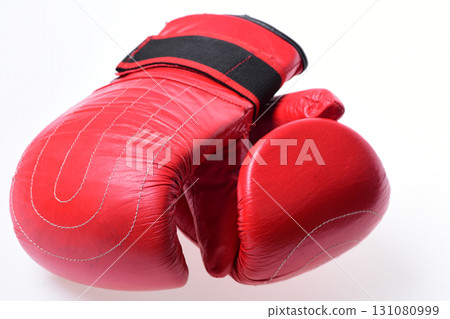 Boxing gloves in red color isolated on white background Boxing gloves in red color isolated on white background 131080999