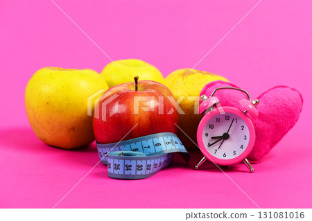 Set of apples in red and yellow colors on tape 131081016