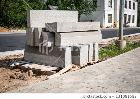 Concrete Curb Stones Stacked at Road Construction Site 131081582