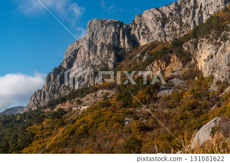 Mountains Crimea Autumn Landscape: Scenic view of Crimean mountains during autumn showcasing diverse flora and rocky terrain. Mountains Crimea Autumn Landscape: Scenic view of Crimean mountains during autumn showcasing diverse flora and rocky terrain. 131081622