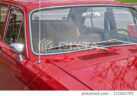 View on interior of retro car through windshield from the side of hood 131082705
