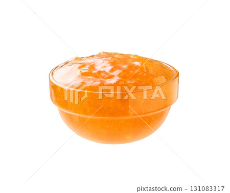 Orange or mandarine jam in a clear glass bowl isolated on white background. Orange or mandarine jam in a clear glass bowl isolated on white background. 131083317