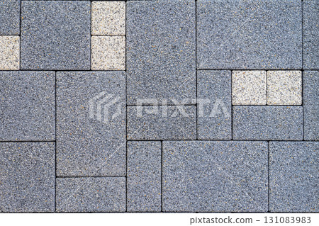 Pattern of paving stones in gray and white shades with rough textured surface. Concept of pavement, stone pattern, construction for decorative outdoor flooring, natural geometric background 131083983