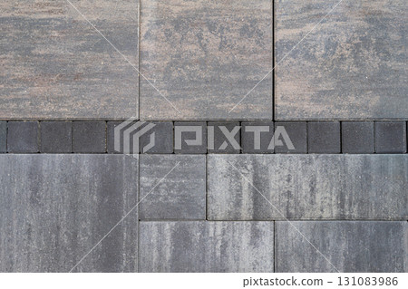 Pattern of paving stones in gray and white shades with rough textured surface. Concept of pavement, stone pattern, construction for decorative outdoor flooring, natural background 131083986