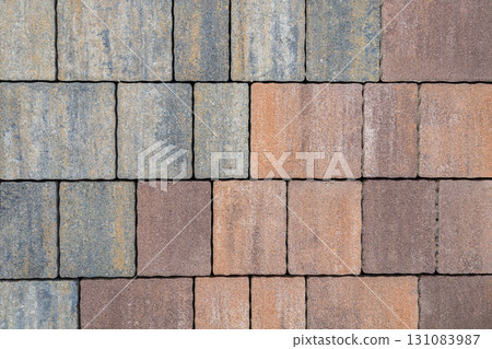 Close-up of paving stones in gray shades with smooth surface and rectangular pattern. Concept of pavement, paving stones, and construction design for urban flooring 131083987