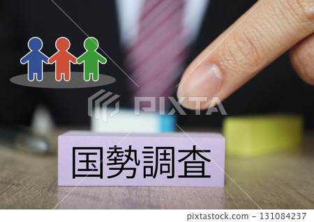 A photo of a man in a suit and sticky notes representing the census 131084237