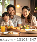 The moment when family members smile and share happiness around the dinner table 131084347