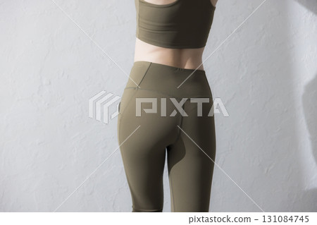 A woman stretching in training wear 131084745