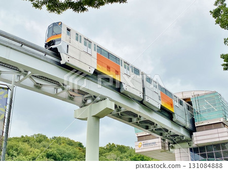 Tama Monorail departing from the station 131084888