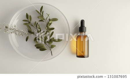 Jojoba oil extract and glass bottle liquid in glass plate sample, wellness healthy life style Jojoba oil extract and glass bottle liquid in glass plate sample, wellness healthy life style 131087695