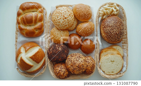 Bakery bagel, baguette, bun bread simple breakfast, flay lay on white table 131087790